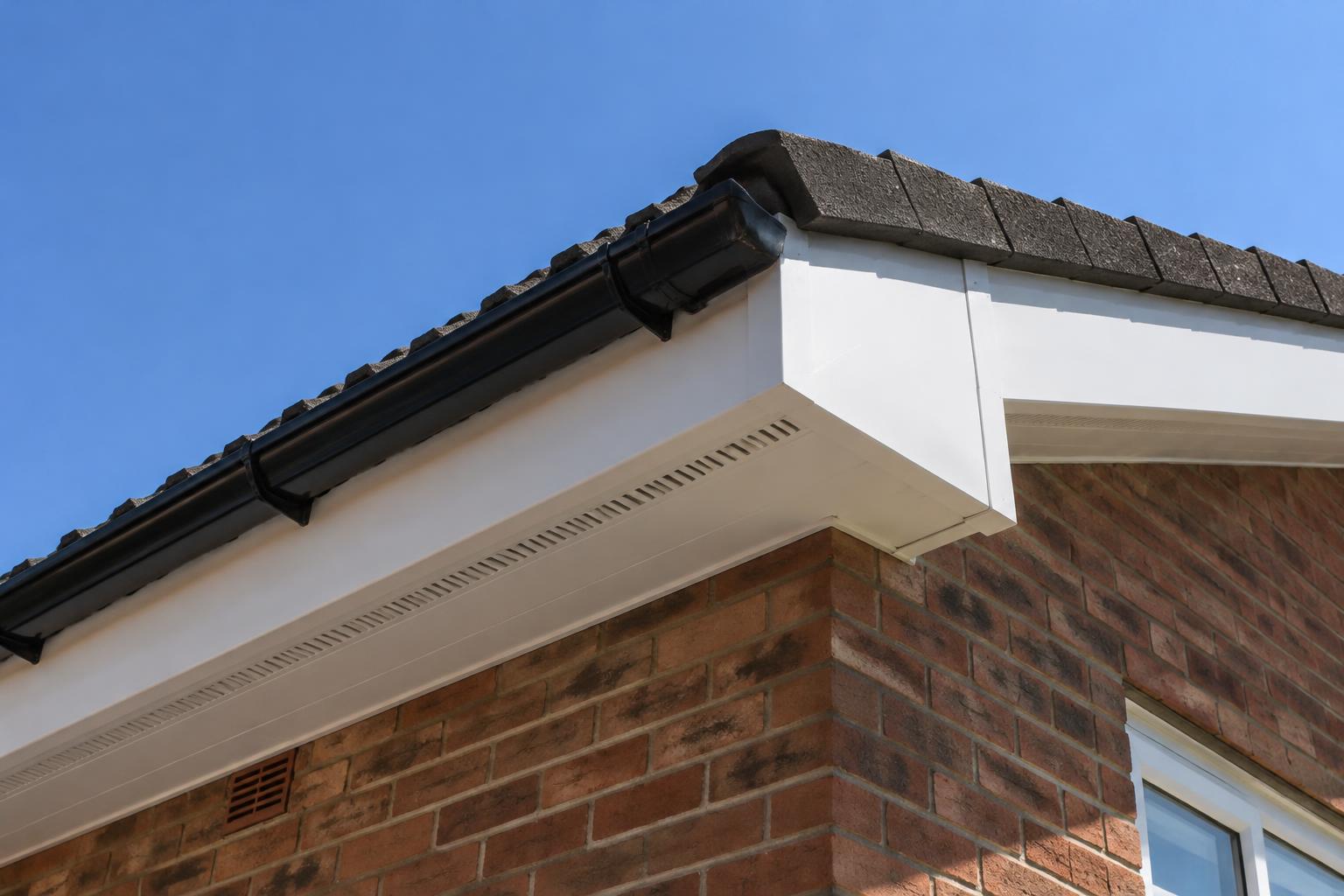 New white uPVC fascia and vented soffit boards beneath a tiled roof edge